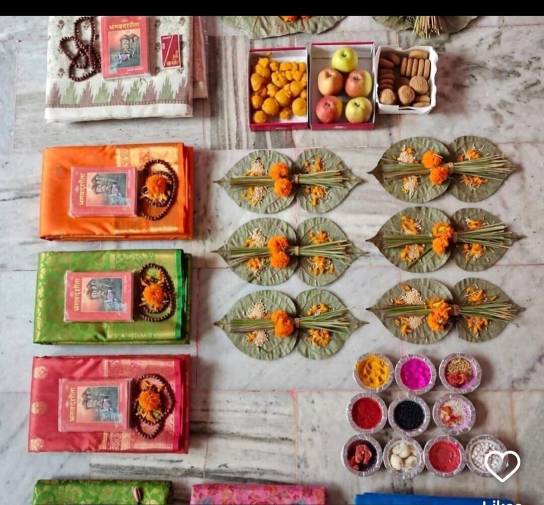 Ritual samagri arranged on leaves — pinda offerings, sindoor, gita